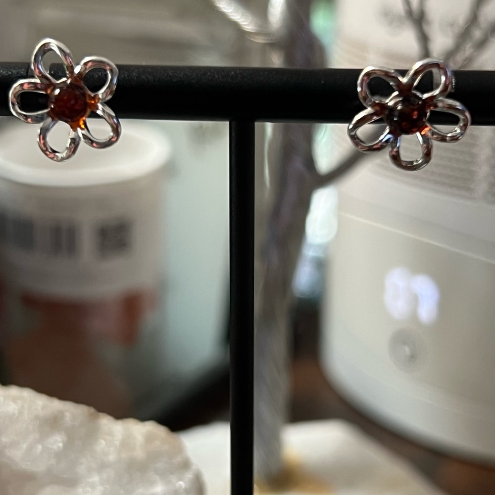 Brand new without tags. Sterling Silver Flower Earrings with Amber center Stone